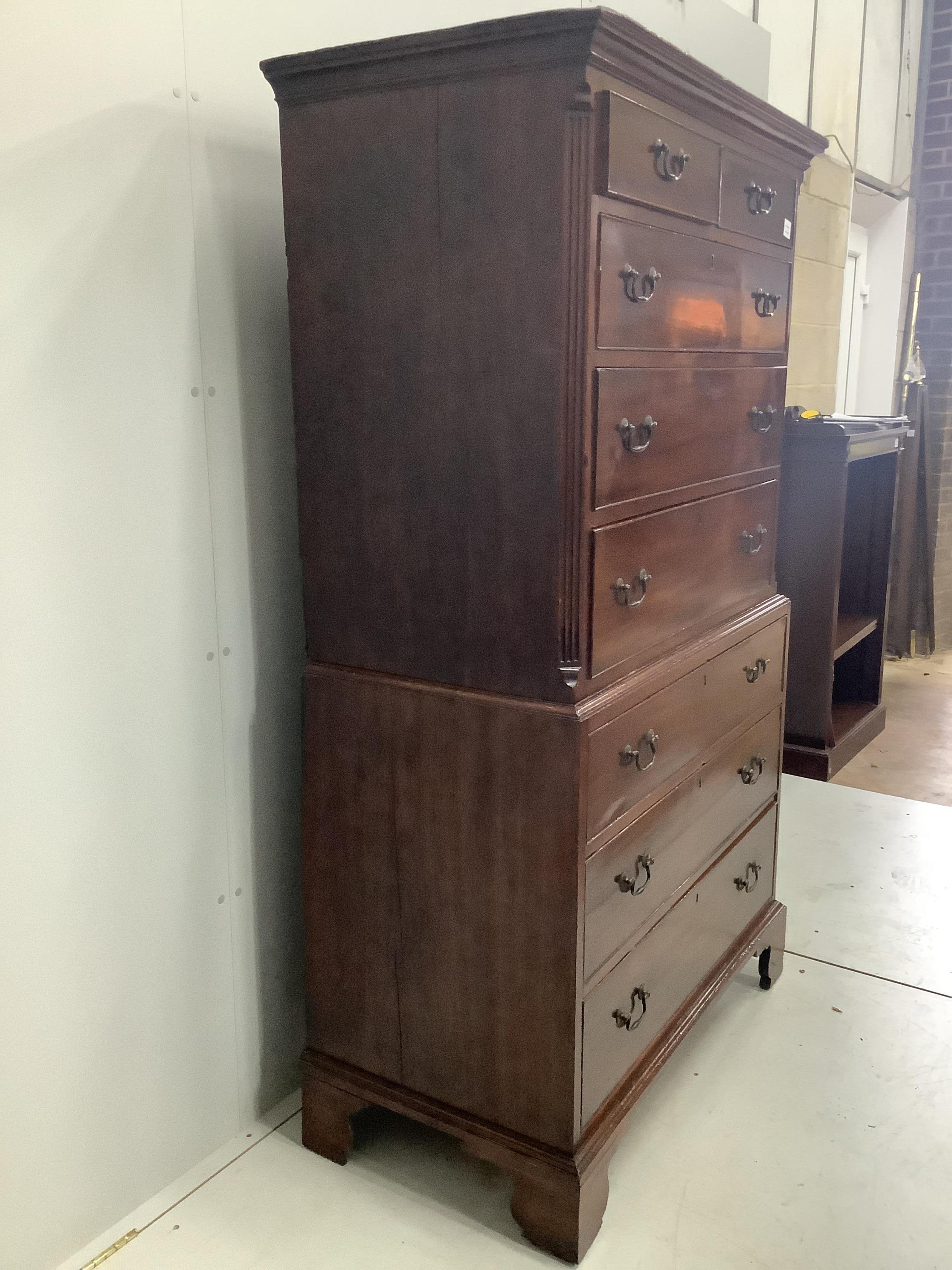 A George III mahogany chest on chest, width 104cm, depth 55cm, height 181cm. Condition - good